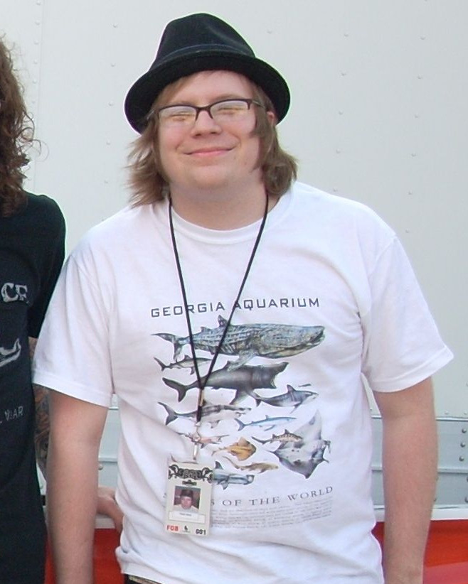Patrick Stump, smiling in his aquarium T-shirt